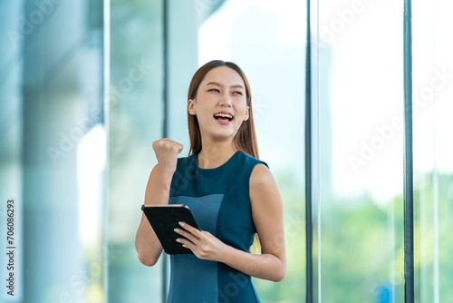 Young Asian Woman Using Digital Tablet with Excitement and Happiness Expression Free Download Young Asian Woman Using Digital Tablet with Excitement and Happiness Expression - GFXLoad