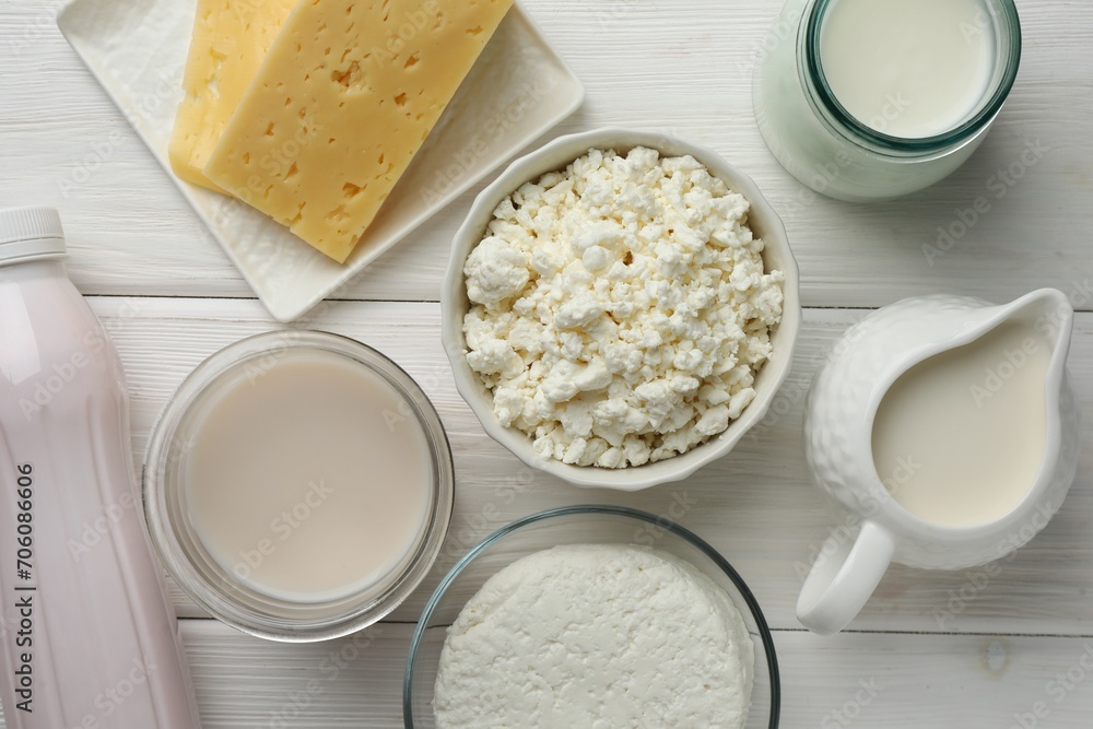 Lactose free dairy products on white wooden table, flat lay