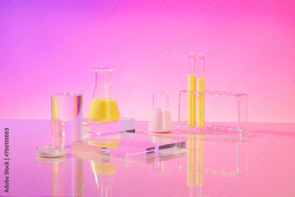 Erlenmeyer flasks and test tubes of yellow liquid displayed over gradient purple background with cylinder and square shaped podiums. Abstract composition in minimal design