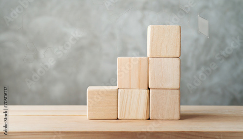 Neatly stacked wooden cubes on table with space for text/infographics symbolize organization, creativity, and customizable information display in a stock photo