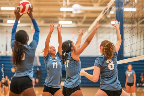 women volleyball players hit the ball using a spiked net