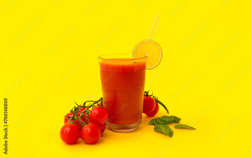Glass of tasty tomato juice on yellow background Glass of tasty tomato juice on yellow background