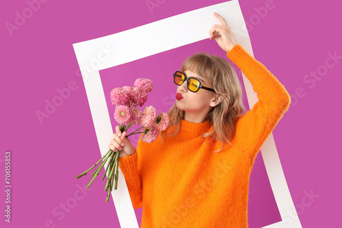 Young woman with flowers an...