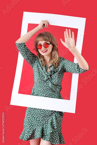 Young woman in sunglasses w...