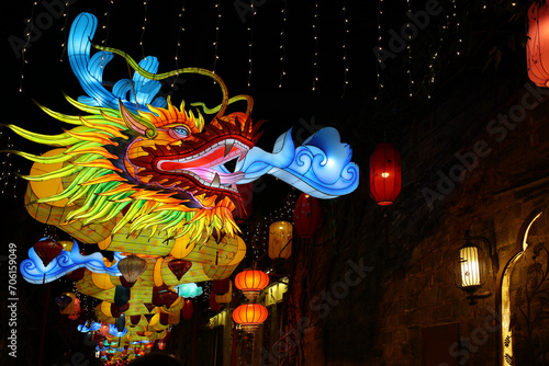 Happy Chinese new year, year of the dragon, zodiac sign hanging beautiful lantern at night