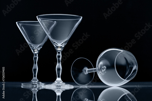 Three empty wine glasses isolated on black background