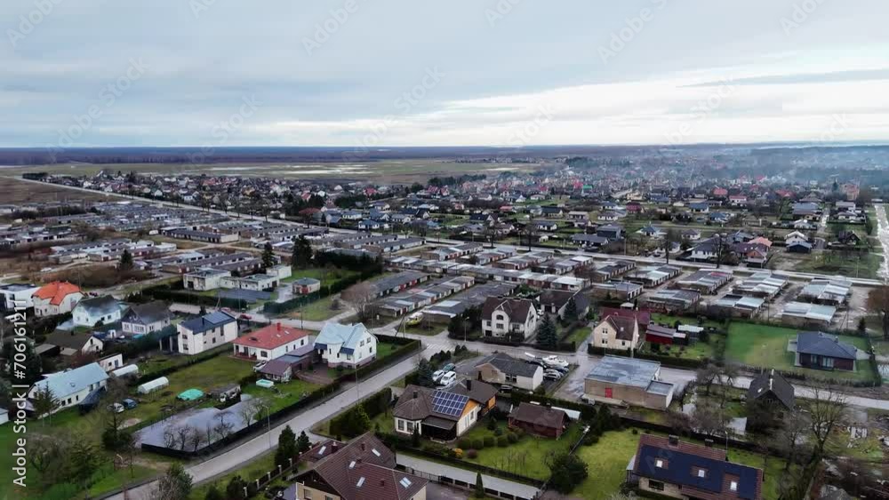 Panoramic aerial overview of European suburbs and trailer home units under grey sky Panoramic aerial overview of European suburbs and trailer home units under grey sky