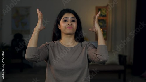 Portrait of an angry woman feeling frustrated and mad - exasperated hand gestures  shock  frustration . Furious young stressed girl having a breakdown - acting aggressively  showing unpleasant reac... photo