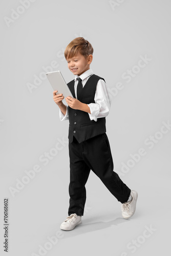 Cute little businessman wit...
