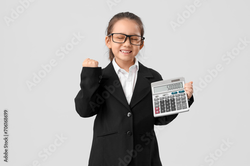 Cute little businesswoman w...