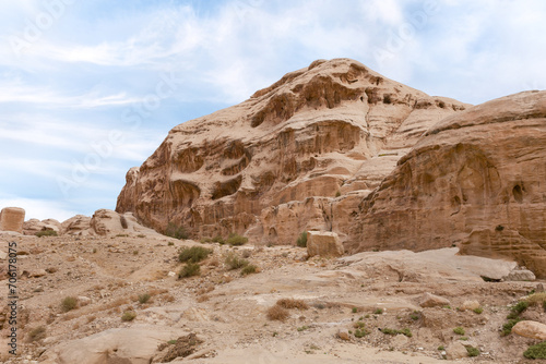 Bizarre shapes of sandstone mountains at beginning of Nabatean Kingdom tourist route in the capital of the Nabatean Kingdom Petra in Wadi Musa city in Jordan