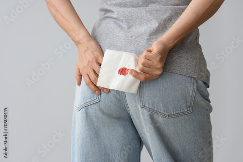 Mature woman holding paper ...