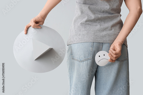 Mature woman with paper thu...