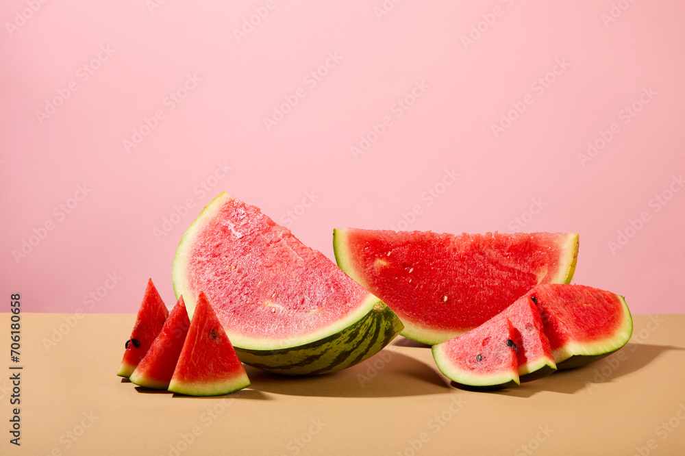 Watermelon with eye-catching bright red color on a pink background. The vitamin C content in watermelon is very high, which helps strengthen the immune system by maintaining the integrity of cells. Watermelon with eye-catching bright red color on a pink background. The vitamin C content in watermelon is very high, which helps strengthen the immune system by maintaining the integrity of cells.