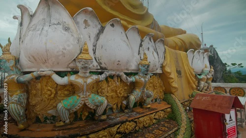 Golden Buddha statue at Tiger Cave Temple Wat Tham Sua in Krabi Thailand. photo