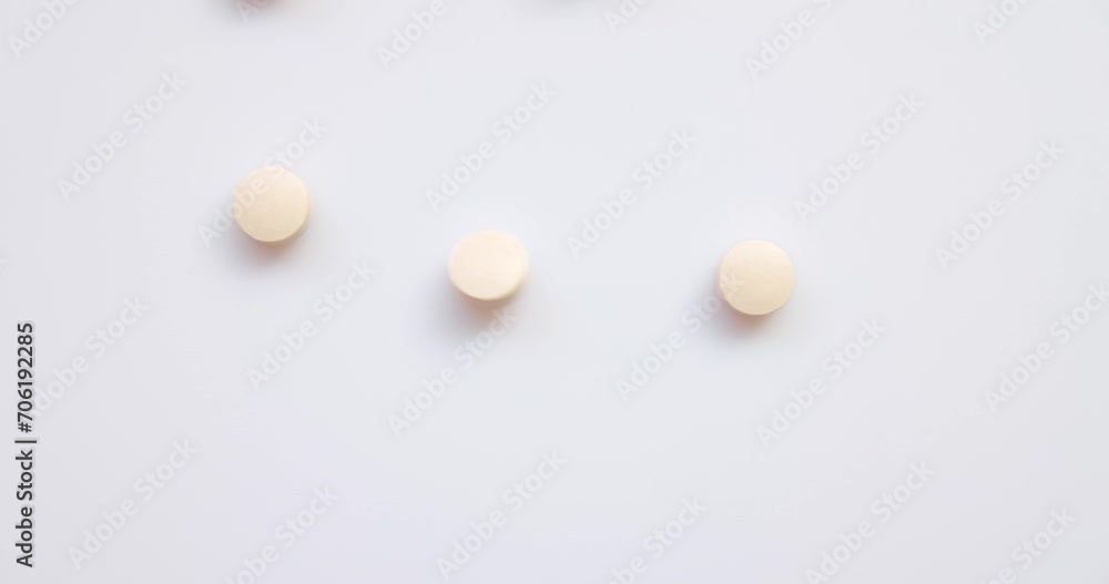 Closeup Top View - a group of pill, and medicine light orange Flying Towards the Camera in Slow Motion in studio. Vitamin supplements for health. Drug addiction. 4k resolution. Closeup Top View - a group of pill, and medicine light orange Flying Towards the Camera in Slow Motion in studio. Vitamin supplements for health. Drug addiction. 4k resolution.