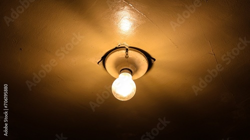 Wallpaper Mural Warm light bulb illuminating a white ceiling Torontodigital.ca