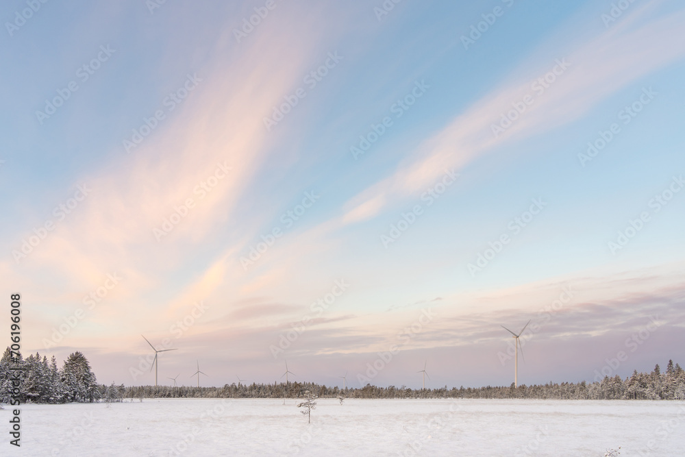 Windmills on a cold winter morning with moody sky in the background