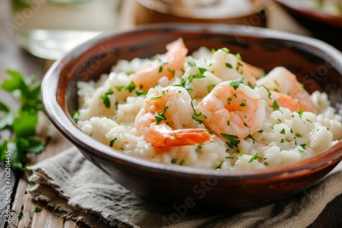 Creamy Shrimp Risotto with Parsley in a Bowl on Wooden Table