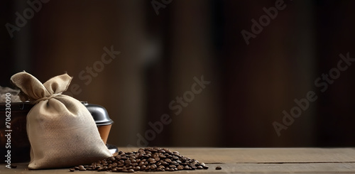 bunch of fresh roasted coffee beans with burlap sack on a wooden table. agriculture and drink concept photo