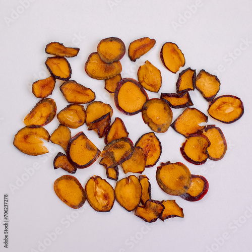 Dried plums slices isolated on a white background with copy space for your text. Top view. Flat lay. top view. content for a blog about healthy nutrition