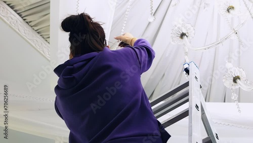 workers decorate the banquet hall for the wedding, setting the decorations for the wedding