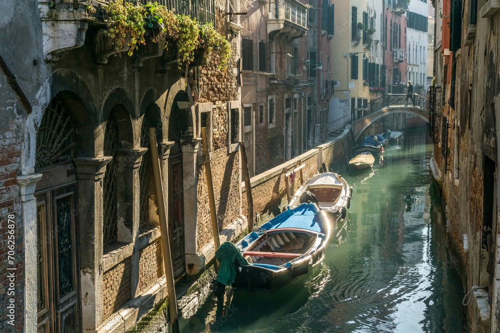 A narrow canal street in Venice, Italy