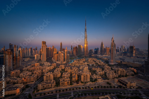 Golden Dawn: Aerial Majesty of Dubai's Skyline Bathed in Sunrise Splendor (ID: 706258426)