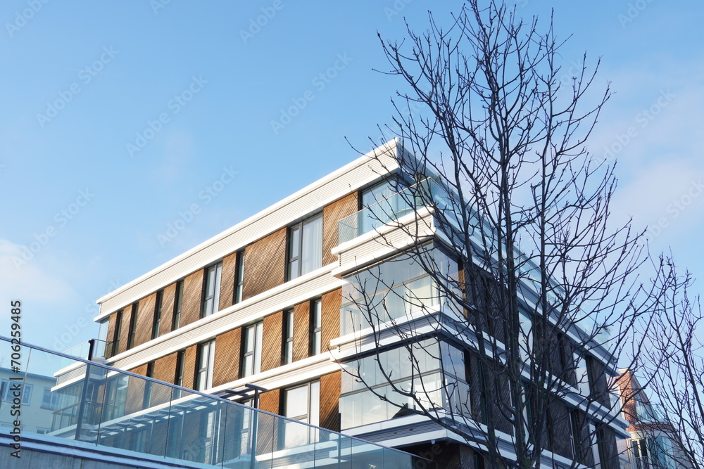 Look up to modern new building in Kalamaja district at sunny day of winter time. Tallinn, Estonia, Europe. January 2024