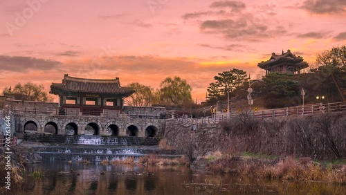 Time lapse, Banghwasuryujeong and Dongbukru in Hwaseong, Suwon with a beautiful sunset. Zoom out photo