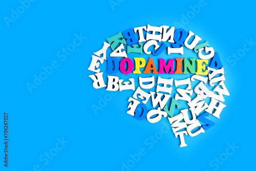Wooden Letters Arranged into a Human Brain Shape and 'Dopamine' Word