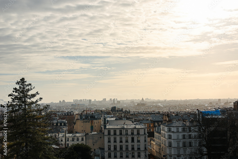 Paris panorama skyline photo. Silhouettes of Paris landmark architecture building during a sunny winter day, view from Montmartre hill.