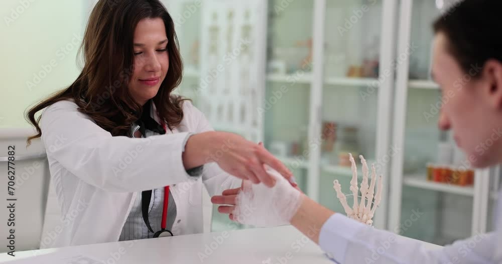 Young wounded man visits woman traumatologist Young wounded man visits woman traumatologist