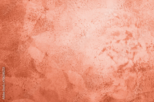 background, texture of concrete and stone in the color of 2024 peach fuzz. High quality photo