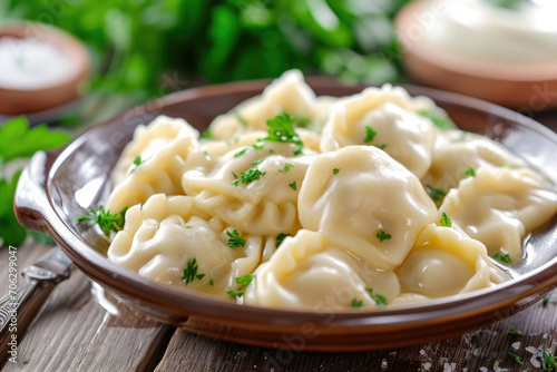 A plate of perfectly boiled pelmeni, traditional Russian dumplings filled with savory meat