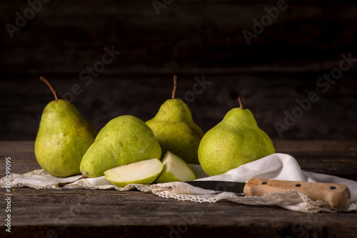 Still life of green pears in rustic style