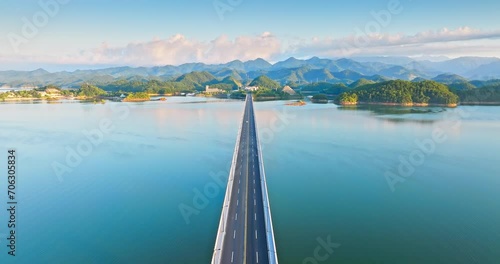 Wallpaper Mural Aerial video of Qiandao Lake Bridge and lake with mountain natural landscape at sunrise in Hangzhou. Drone shooting forward. Torontodigital.ca