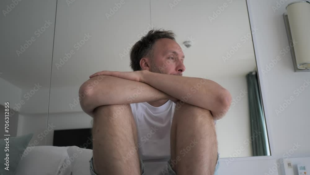 Tired middle age man alone at home. Emotional stress, burnout and midlife crisis concept. Tired middle age man alone at home. Emotional stress, burnout and midlife crisis concept.