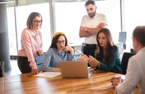 Wallpaper Mural Female leader speaking with employees in office Torontodigital.ca