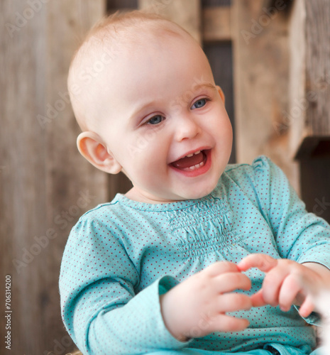 Cute smiling ten month old baby photo