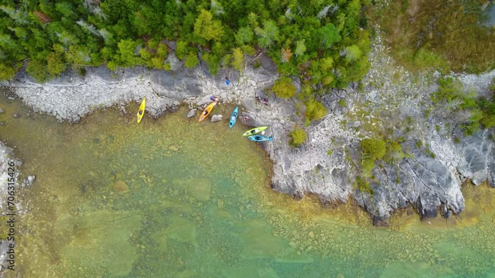 Aerial topdown view of lake shorline with kayaks at Georgian Bay, Ontario, Canada