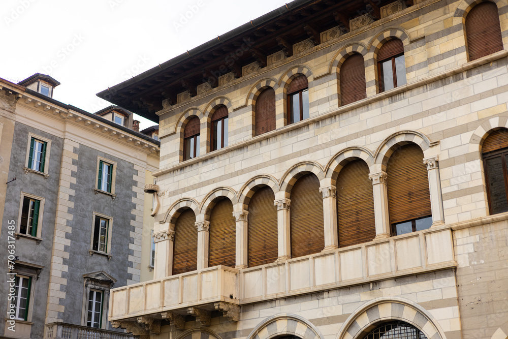 Como, Italy, historic city architecture. A building with the characteristic facade and windows. Summer day