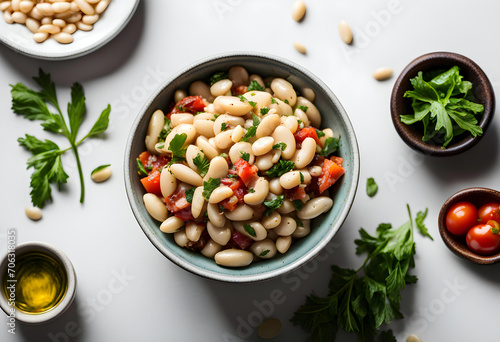 A bowl of delicious Mediterranean White Bean Salad of top view. photo