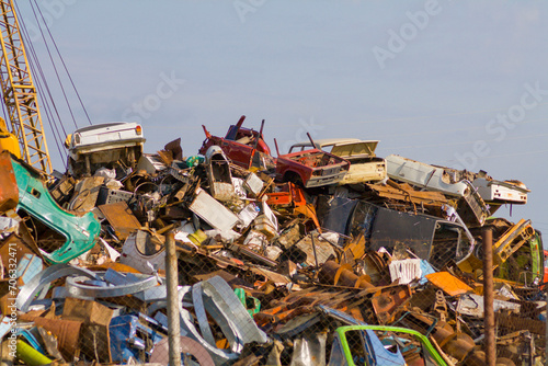 a large pile of old cars prepared for recycling