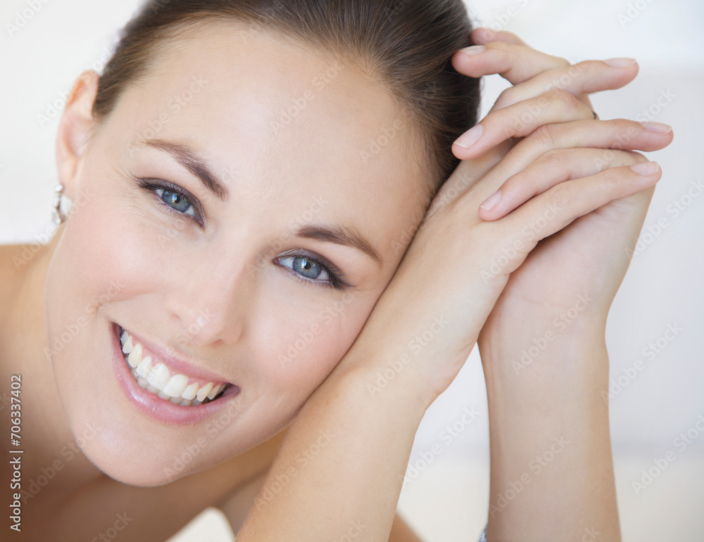 Close up Portrait of Smiling Woman with Head Leaning on Hands
Close up Portrait of Smiling Woman with Head Leaning on Hands