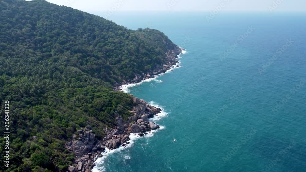 Rocky cliffs, Mango Bay , Ko Tao, dramatic spectacle, rising above ocean water Rocky cliffs, Mango Bay , Ko Tao, dramatic spectacle, rising above ocean water