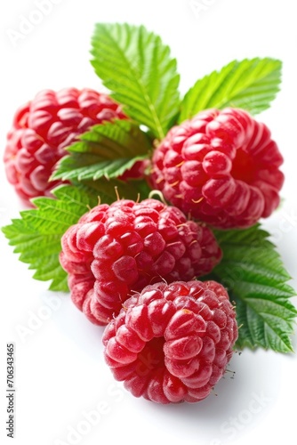 Three raspberries with leaves placed on a white surface. Suitable for food photography or healthy eating concepts