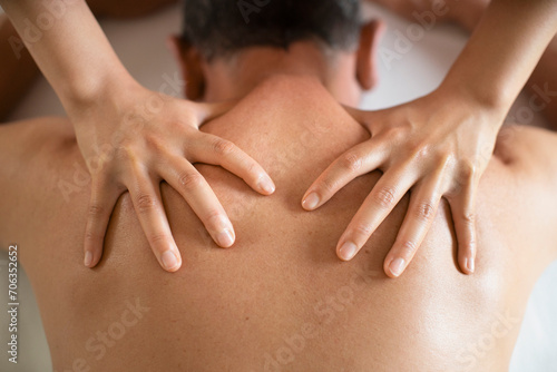 View from above man receiving shoulder massage at spa
 photo