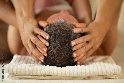 Close up man receiving head massage
 photo