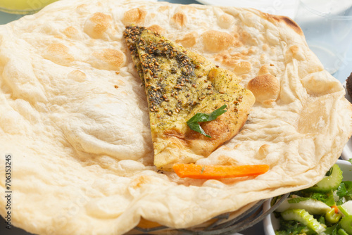 Still life close up baked Israeli laffa flatbread with zaatar
 photo